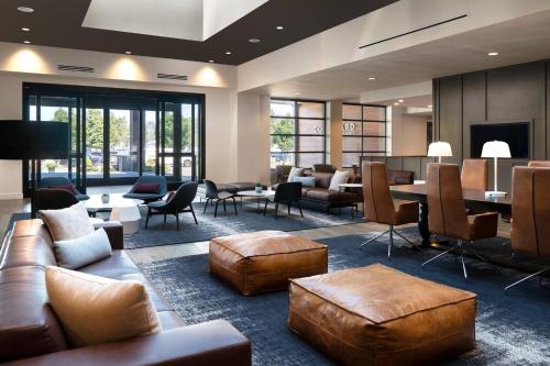 a lobby with couches and chairs and a table at Courtyard Seattle Downtown/Lake Union in Seattle