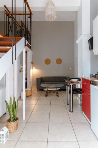 a living room with a couch and a table at A & D Houses in Patra