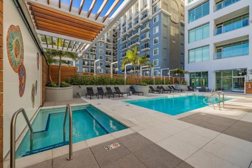 a swimming pool in a building with a building at @ Marbella Lane - Penthouse w/ City & Ocean Views in Long Beach