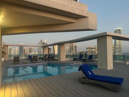 a pool on the roof of a building at Grand Bay Tower in Panama City