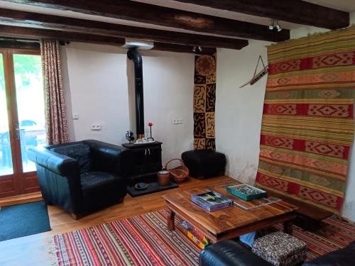 a living room with a couch and a table at Penstone Grange in Campan