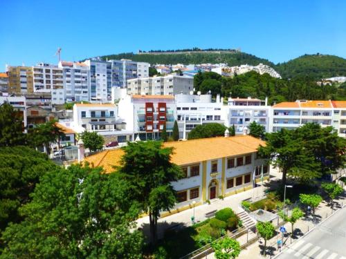 an aerial view of a city with buildings at Your Home near the beach - Sesimbra in Sesimbra
