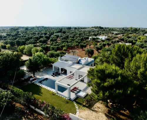 an aerial view of a white house in the countryside at Villa Kalorama-private pool & Hot Tub in San Vito dei Normanni