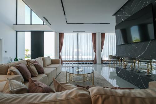 a living room with a couch and a table at The Panoramic Villa in Široka
