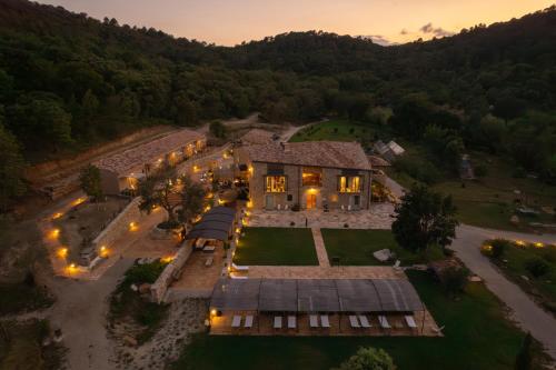an aerial view of a house with lights at ECOTurisme Can Buch HOTEL in Sant Aniol de Finestras