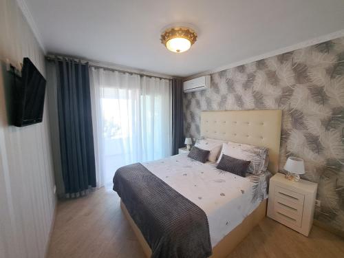 a bedroom with a bed and a television in it at Rancho B 5 in Mijas Costa