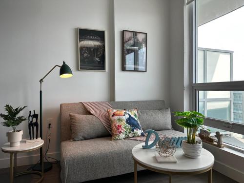 a living room with a couch and a table at Gorgeous Place In Downtown RMD in Richmond