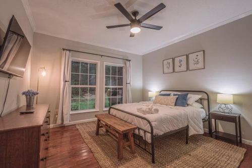 a bedroom with a bed and a ceiling fan at Oasis on 151 - Ideal Location on Brew Ridge Trail in Faber