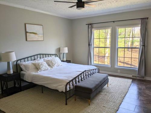 a bedroom with a bed and a large window at Oasis on 151 - Ideal Location on Brew Ridge Trail in Faber