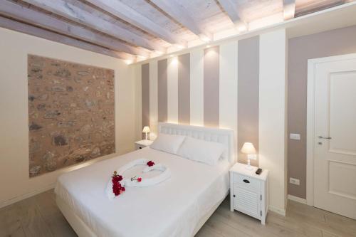 Ένα ή περισσότερα κρεβάτια σε δωμάτιο στο Bertoletta Village Apartments