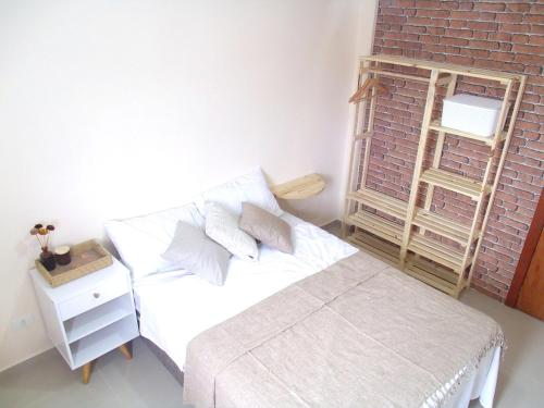 Posteľ alebo postele v izbe v ubytovaní Cobertura com Piscina e Churrasqueira Mongaguá SP