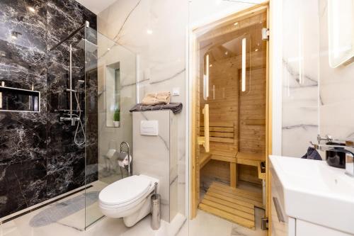 a bathroom with a toilet and a shower at High end 2 bedroom apartment in downtown in Budapest