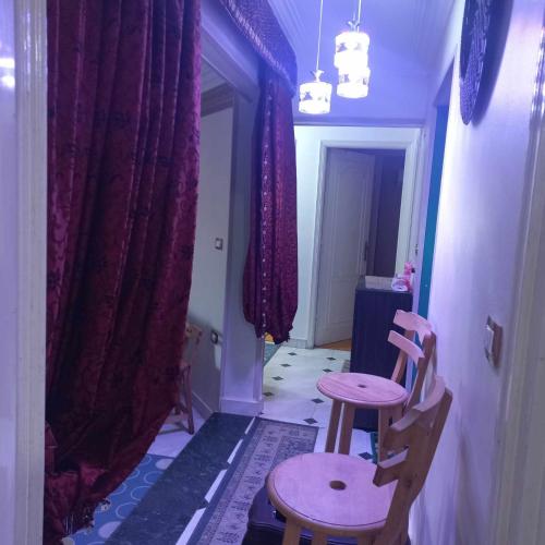 a room with two chairs and a table in it at Aqua Tanta Group طنطا Families Only in Tanta
