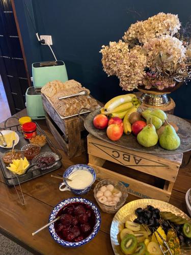 a table topped with lots of different types of food at The Narrows Landing Hotel in Hamilton
