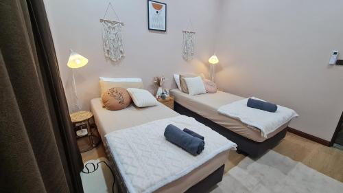 Postel nebo postele na pokoji v ubytování บ้านเซฟโซน