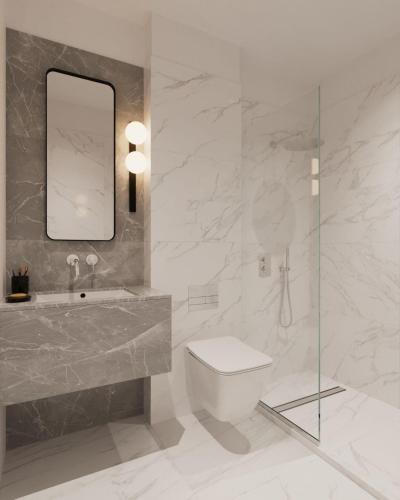 a bathroom with a sink and a toilet and a mirror at Downtown Suites by Athens Tower in Athens