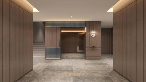 a lobby with wooden walls and a hallway with a door at Holiday Inn Express Shanghai Pujiang Lianhang Road by IHG in Shanghai