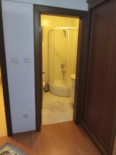 a doorway to a bathroom with a shower and a toilet at Family house in Ankara