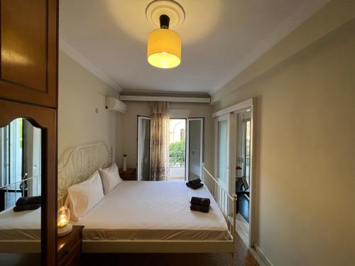 Postel nebo postele na pokoji v ubytování Port House Apartment