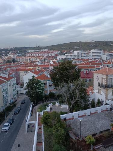 a view of a city with cars and buildings at Vista Panorâmica Amadora in Amadora