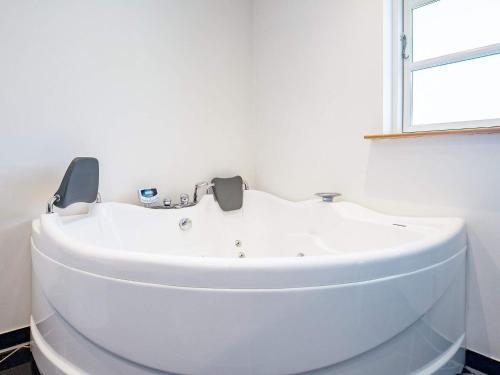 a white sink in a bathroom with a window at Luxury Spa Retreat in Lolland - By Traum Ferienwohnungen in Nakskov
