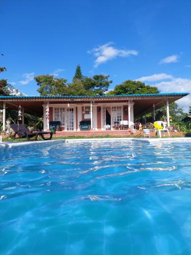 a house with a pool in front of it at Villa Monica in Montenegro