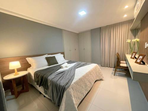 A bed or beds in a room at Apartamento praia Cabo Branco - João Pessoa