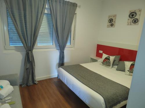 Posteľ alebo postele v izbe v ubytovaní Apartamentos en Leis Muxia