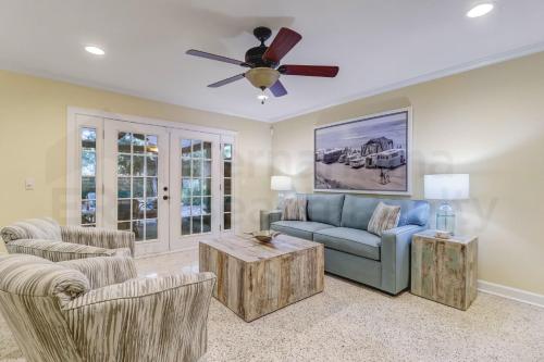a living room with a couch and a ceiling fan at 223 Lighthouse Circle home in Fernandina Beach