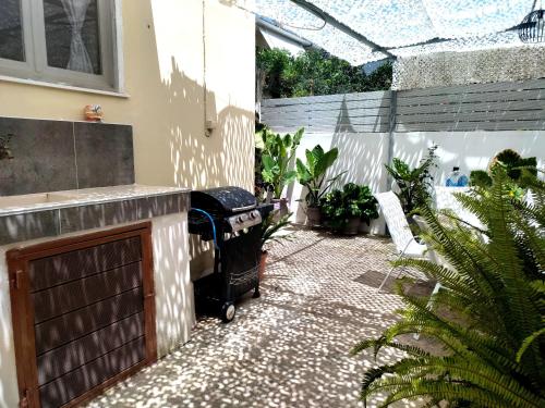 a patio with a gate and a courtyard with plants at Luxury house near by Delphi in Kírra