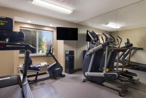 a gym with two tread machines in a room at Sleep Inn Erie near Sports Center in Erie