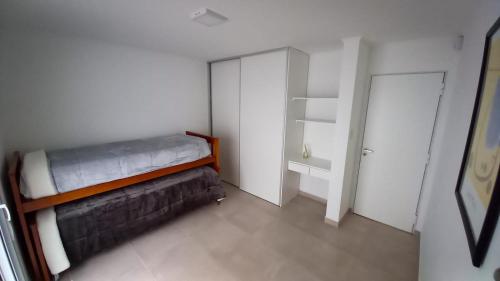 Ένα ή περισσότερα κρεβάτια σε δωμάτιο στο Duplex del Parque