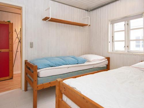 a bedroom with two beds and a window at 4 person holiday home in Sydals-By Traum in Østerby