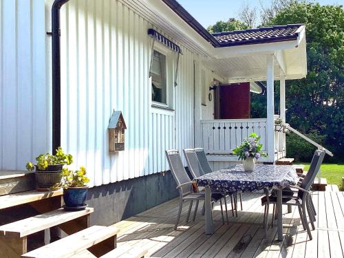 a patio with a table and chairs on a house at 6 person holiday home in UDDEVALLA-By Traum in Uddevalla