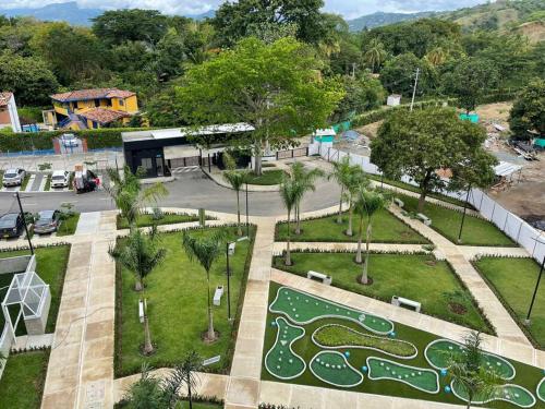 an aerial view of a park with a golf course at Apto Di Sole Santa FeAntioquia in Santa Fe de Antioquia