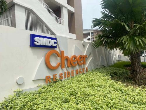 a sign on the side of a hotel building at Twenty-Nine Cats - SMDC Cheer Residences Marilao in Marilao