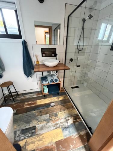 a bathroom with a sink and a shower at The Deck in Burnie