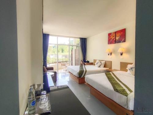 Postel nebo postele na pokoji v ubytování The Piano Resort Khaoyai