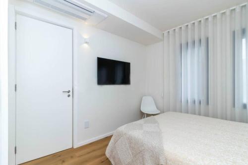 Postel nebo postele na pokoji v ubytování Oporto Apartments in Casa da Música by Luxistay