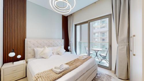 Postel nebo postele na pokoji v ubytování Primestay - Creek Vista Reserve B 1BR in Al Meydan