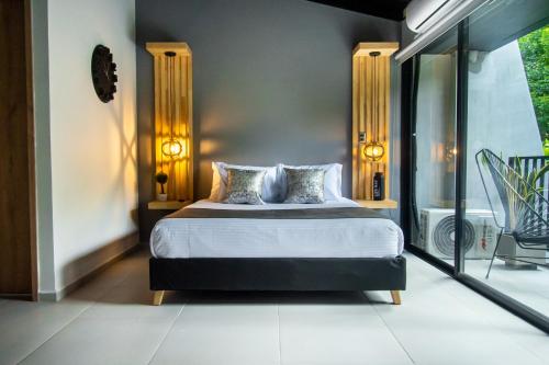 a bedroom with a bed and a balcony at Barcelo Coliving in Medellín