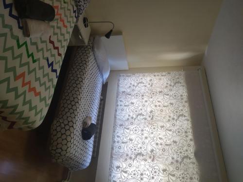 a small room with a window and a curtain at Room in Guest room - H Individual In Reformed Residence wifi center in Madrid