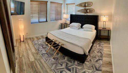 a bedroom with a large bed and a rug at Rr-edgewater04 in June Lake