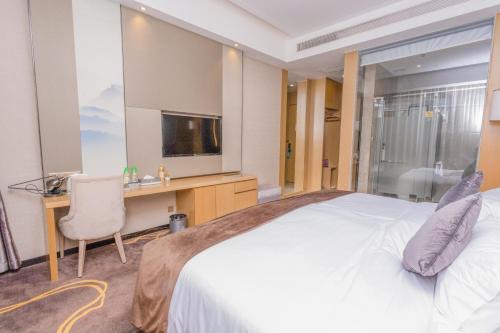 Ένα ή περισσότερα κρεβάτια σε δωμάτιο στο Taishan He Style Hotel