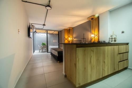 a room with a counter and a bed in a room at Barcelo Coliving in Medellín