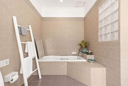 a bathroom with a bath tub and a sink at Beach Resort 2 Bedroom Pool Villa in Lamai
