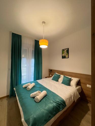 Llit o llits en una habitació de Pini Apart-hotel