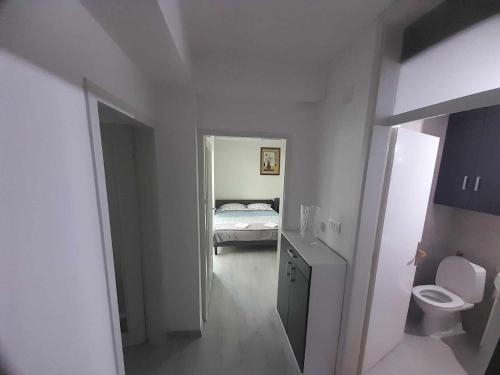 Postel nebo postele na pokoji v ubytování Apartman Ohrid