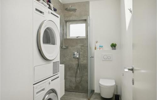 a bathroom with a shower and a washing machine at Amazing Home In Glostrup With Wifi in Glostrup