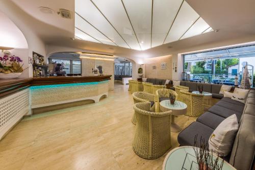 a restaurant with a pool in the middle of a room at Hotel Diamond in Riccione